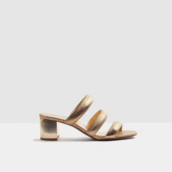 Michael Kors Paloma Flex Mule sandal in gold metallic leather